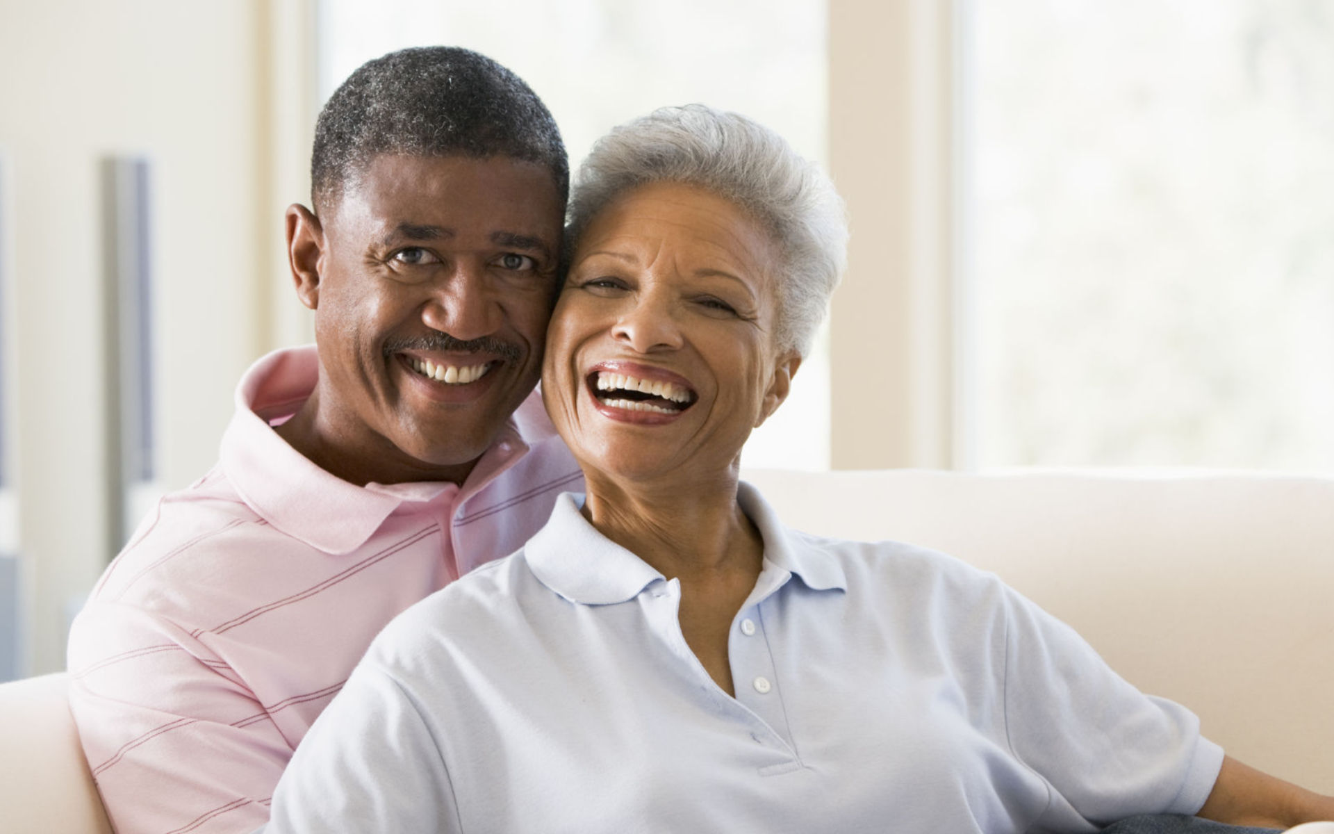 Happy senior Afro-American couple with perfect smiles.