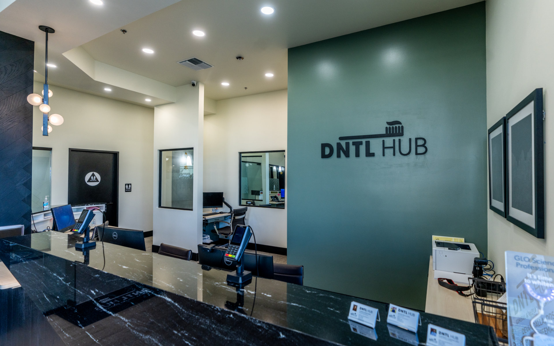 dntlhub office with logo on the wall